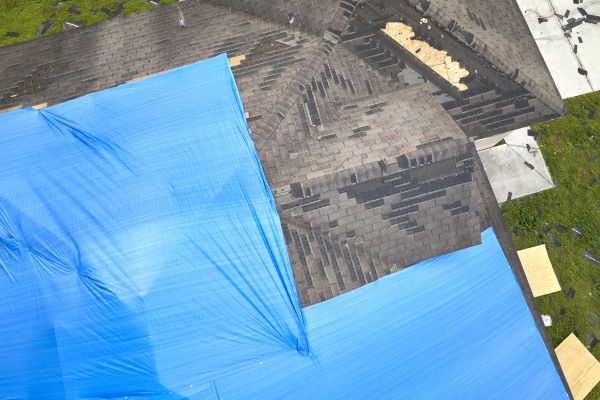 Storm Damage Roof Tarping in Utica
